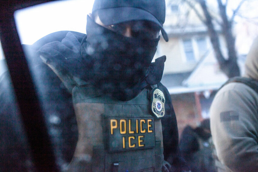 A masked U.S. Immigration and Customs Enforcement agent knocks on a car window in Minnesota on Jan. 12. A new court ruling allows ICE to use Medicaid data, alarming some states and advocates who warn it could have a chilling effect on immigrant families accessing health care. (Photo by Nicole Neri/Minnesota Reformer)