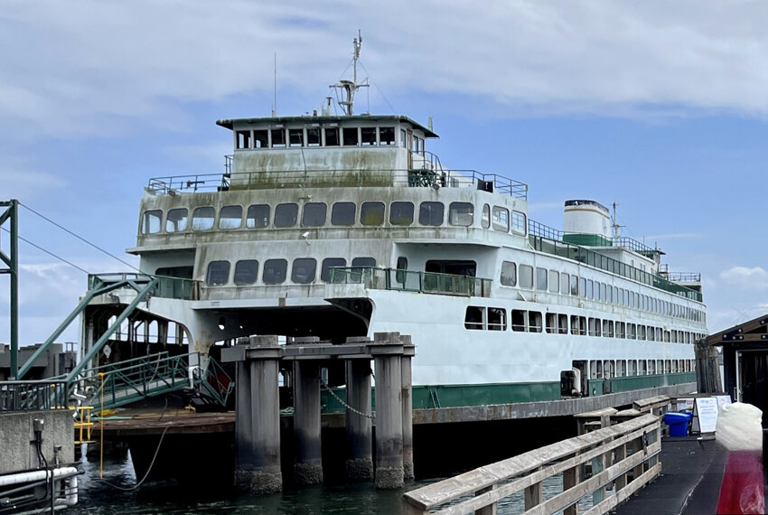 The retired ferry Hyak has been gathering moss for the past five years, previously in Kingston and now in Eagle Harbor. A Seattle shipyard recently offered to refurbish the inoperable vessel and lease it back to Washington state. (Photo by Tom Banse)