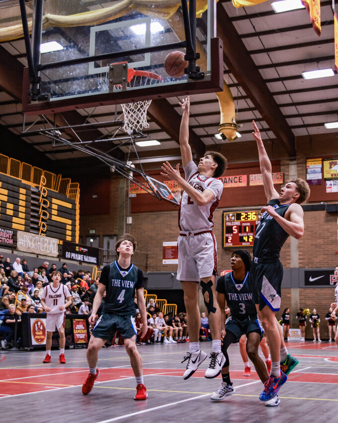 Prairie junior forward Griffin Smith makes an early basket in the Falcons&rsquo; 66-65 overtime loss to Mountain View High School on Friday, Jan. 23.