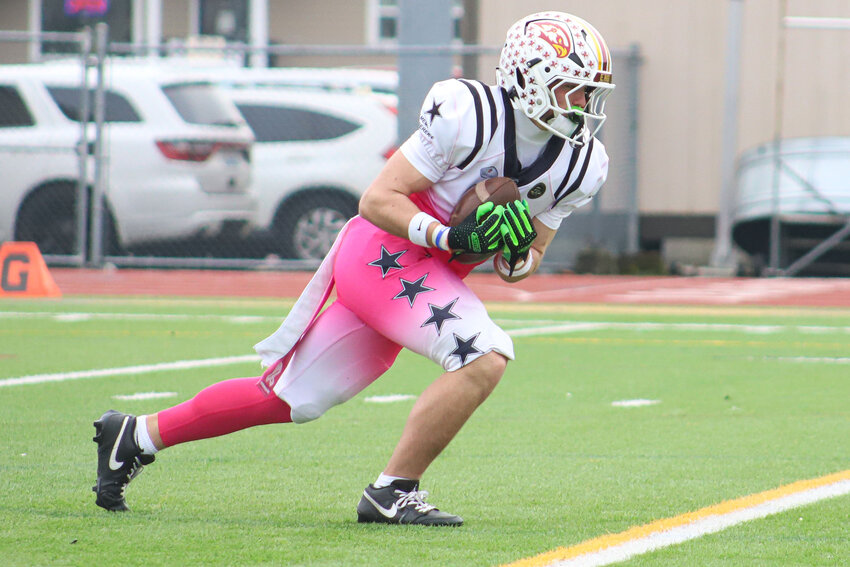 Prairie's Jackson Kimball returns a kick during the Cleats Vs. Cancer High School Senior All-Star Game at Sunset Stadium in Sumner on Monday, Jan. 19.