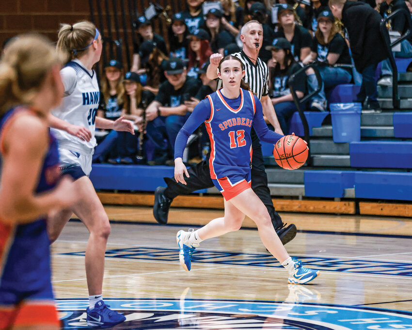 Ridgefield junior forward Addison Veitenheimer looks down the court for a pass as she crosses the mid-line during the Spudders&rsquo; 67-32 win over the Hockinson Hawks on Wednesday, Jan. 28.