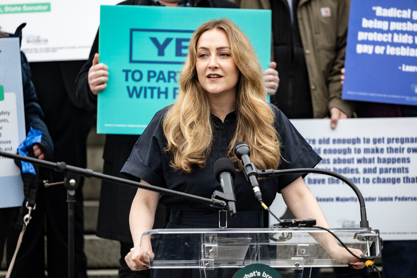 Podcaster Brandi Kruse leads a Let&rsquo;s Go Washington rally supporting initiatives concerning parental rights and barring transgender athletes from participating in girls&rsquo; athletics at the Washington state Capitol on Tuesday, Feb. 3.
