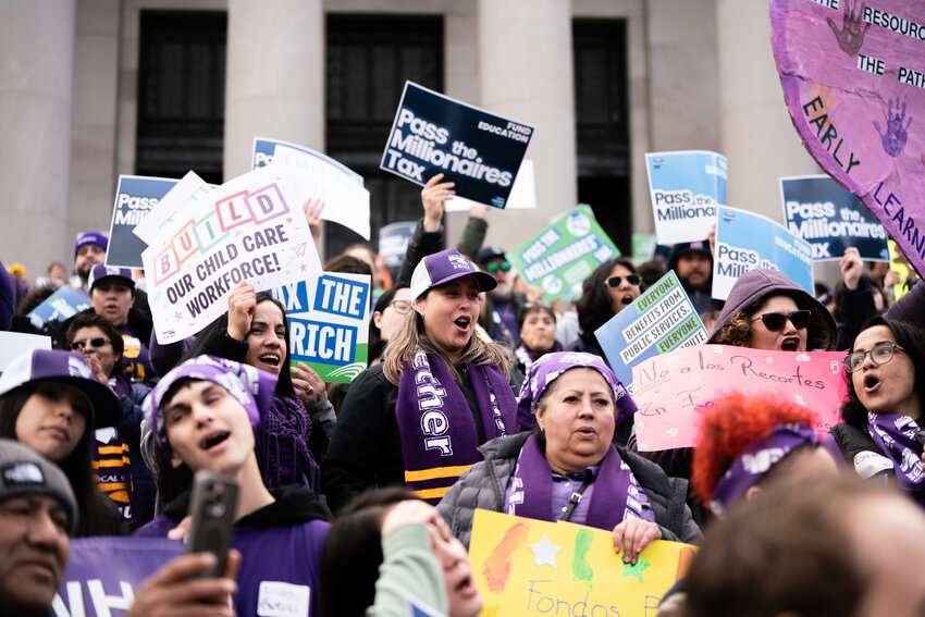 Demonstrators with the Service Employees International Union hold signs in support of Senate Bill 6346, dubbed the &ldquo;Millionaires Tax&rdquo; bill, during a rally at the Washington State Capitol in Olympia on Tuesday, Feb.10.