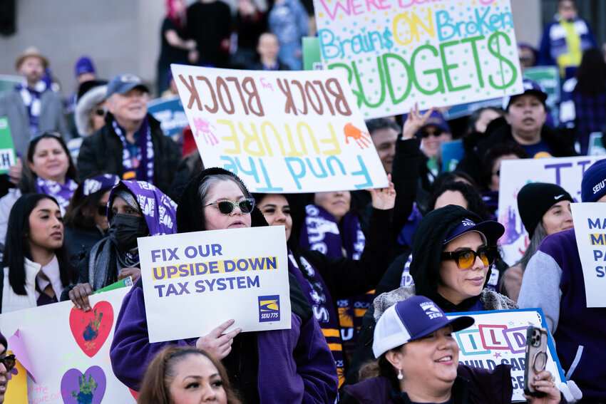 Demonstrators with the Service Employees International Union hold signs in support of Senate Bill 6346, dubbed the &ldquo;Millionaires Tax&rdquo; bill, during a rally at the Washington State Capitol in Olympia on Tuesday, Feb.10.