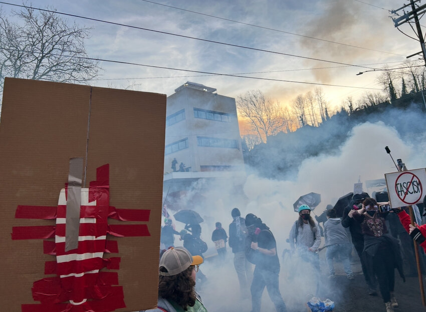 Members of 30 Oregon labor unions organized a march against Immigration and Customs Enforcement, or ICE, near an ICE facility in Portland on Jan. 31, 2026. The march ended at the facility, where federal officers shot tear gas, pepper balls and rubber bullets at the crowd, which included children. (Photo by Alex Baumhardt/Oregon Capital Chronicle)
