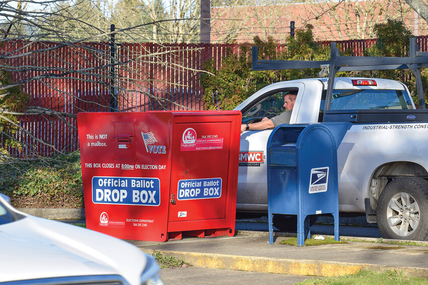 Voters drop off ballots near the City of Battle Ground&rsquo;s post office during the Tuesday, Feb. 10, special election. Early results showed Battle Ground Public Schools&rsquo; proposed educational programs and operations levy failing by 555 votes, as the Hockinson School District&rsquo;s replacement school programs and operations levy is passing by 467 votes.