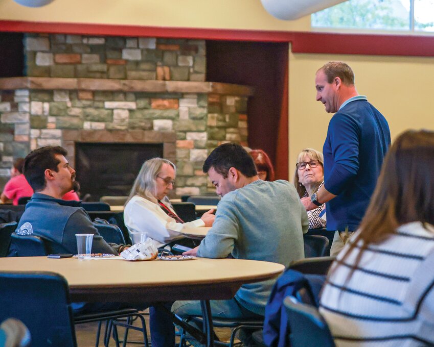The Reflector Publisher Chad Taylor, right, speaks with attendees at The Reflector&rsquo;s first &ldquo;Best of the Best&rdquo; awards banquet in May, 2025.