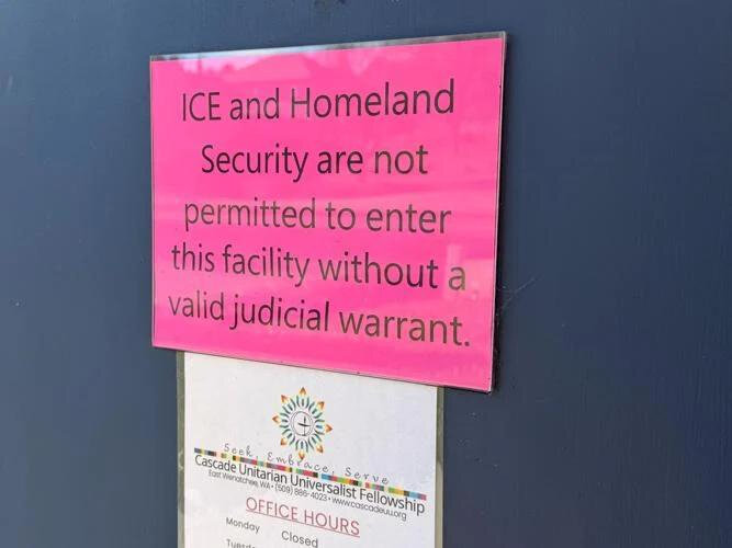 A sign hangs that says &ldquo;ICE and Homeland Security are not permitted to enter the facility without a valid judicial warrant,&rdquo; at Cascade Unitarian Universalist Fellowship in East Wenatchee. (Photo by Rene&eacute; D&igrave;az/Wenatchee World)