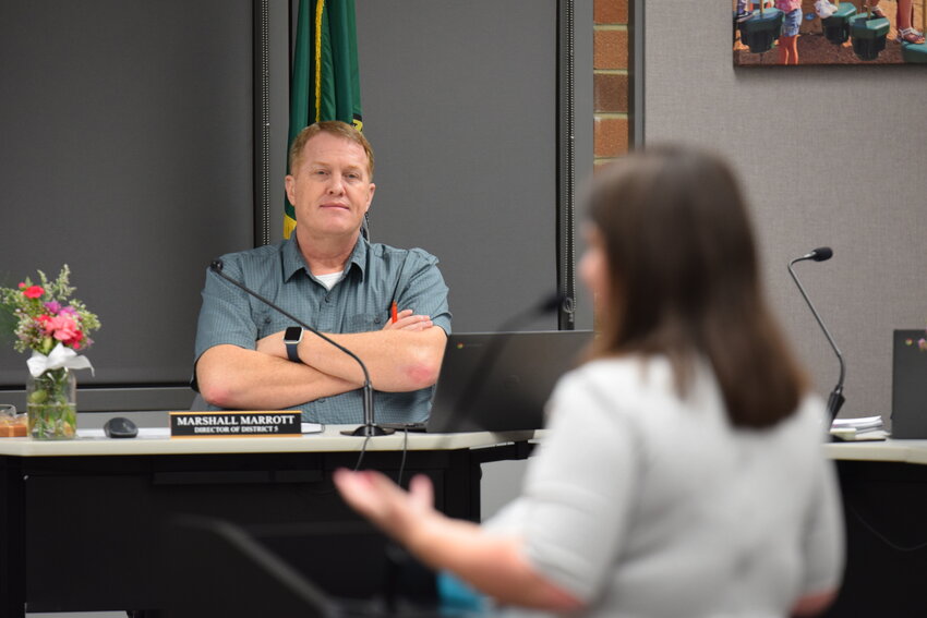 Substitute teacher Ashley Stoker speaks to the school board on Feb. 23 about maintaining school security staffing. Stoker described relying on security staff during serious incidents, including a recent situation involving a weapon in her classroom.