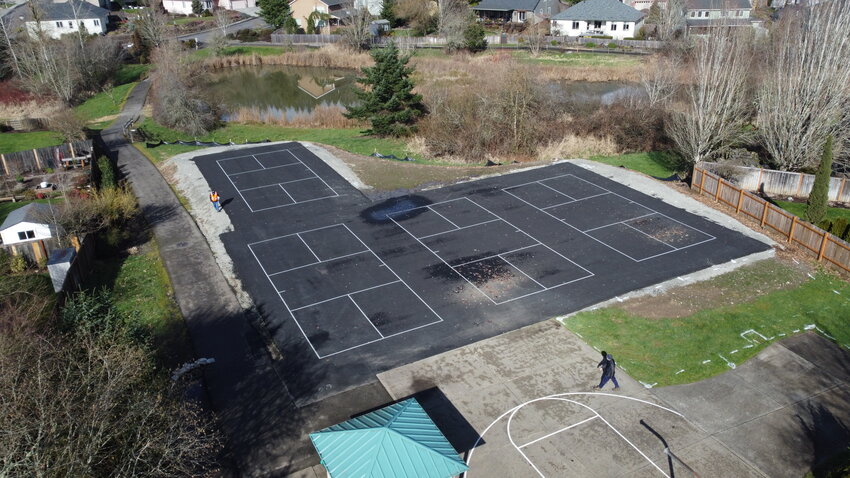 Newly striped pickleball courts at Heritage Park are currently without perimeter fencing. The La Center City Council on Feb. 25 approved a $16,208.55 contract to install fencing around the sports courts as the project nears completion.