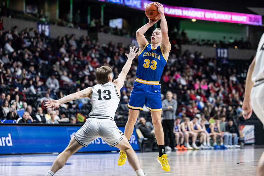 Columbia Adventist's Tristan White (33) shoots the ball during a 1B State Quarterfinal game against Almira Coulee Hartline at the Spokane Arena on Thursday, March 5.