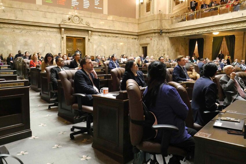 Democratic lawmakers watch as the roll is called on final passage of the income tax bill after nearly 25 hours of debate. (Photo by Bill Lucia/Washington State Standard.