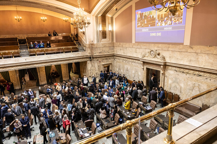 Legislators, family members and friends join lawmakers on the House floor to celebrate the last day of the legislative session on Thursday, March 12, in Olympia.