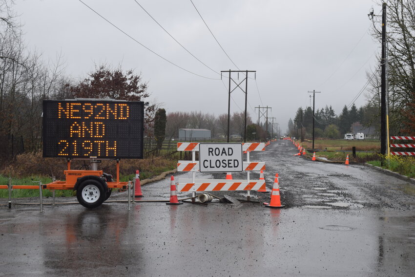 The roadway remains blocked at Northeast 92nd Avenue at its connection to state Route 503 in Battle Ground. The City of Battle Ground has extended the closure through July 17, 2026 while contractors install water and sewer utilities for the Village at Cherry Grove subdivision.