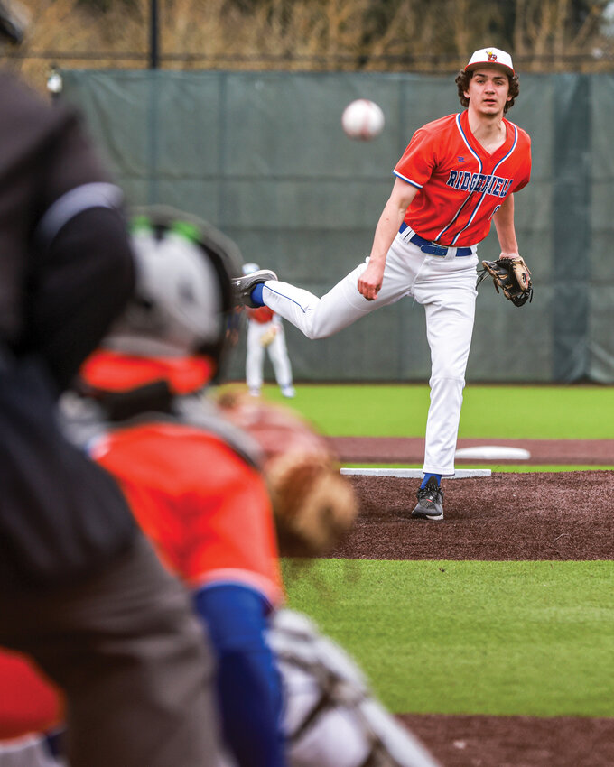 Ridgefield pitcher Henry Wikstrom watches his pitch go in for a strike in the Spudders&rsquo; 1-0 victory over Anacortes High School on Thursday, March 19.
