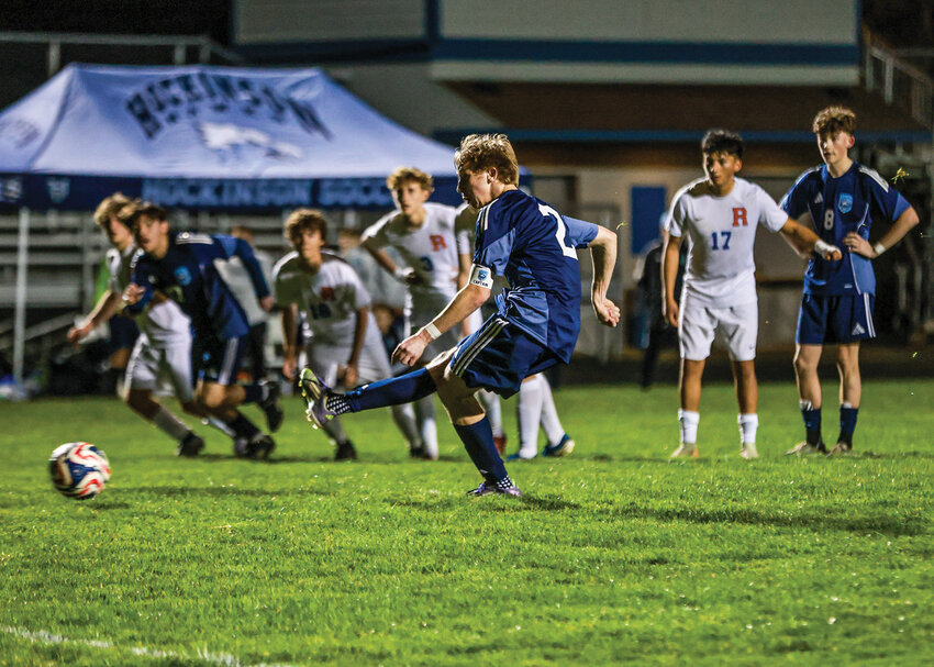 Hockinson senior Trey Bischoff kicks a penalty kick for the game&rsquo;s lone goal as the Hawks beat rival Ridgefield Spudders 1-0 on Tuesday, March 17.