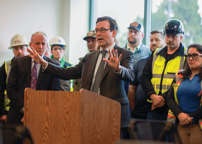 Washington Gov. Bob Ferguson speaks to a crowd during a press conference in Vancouver on March 17. Leaders outlined a new cost estimate for the Interstate Bridge Replacement project and reaffirmed their commitment to moving forward.