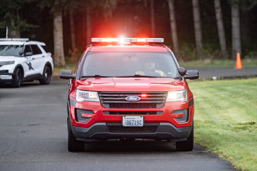 A first responder drives up to Rochester High School to respond to a mock crash to bring awareness to distracted and impaired driving on Thursday, April 2.