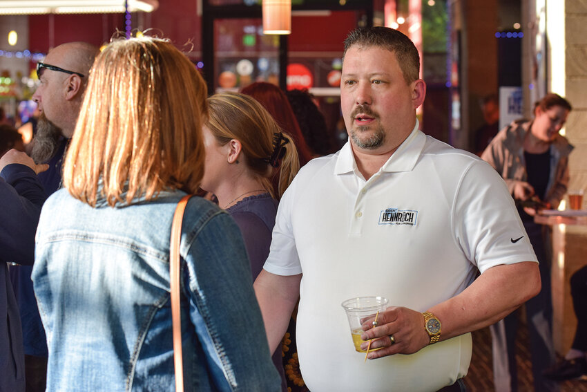 Brent Hennrich speaks with attendees during a campaign kickoff event at AMC Classic theater in Vancouver on Thursday, April 2. The gathering marked the start of his campaign to represent Washington&rsquo;s 3rd Congressional District.