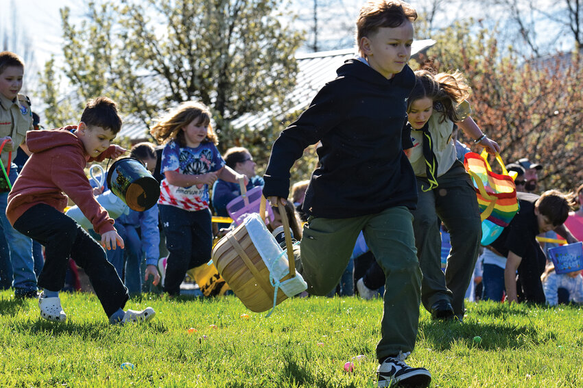Kids sprint across the field as Fire District 3 sounds the starting horn at the Kiwanis Park Easter Egg Hunt on April 4. The annual event drew more than 300 attendees for a fast-paced community tradition.