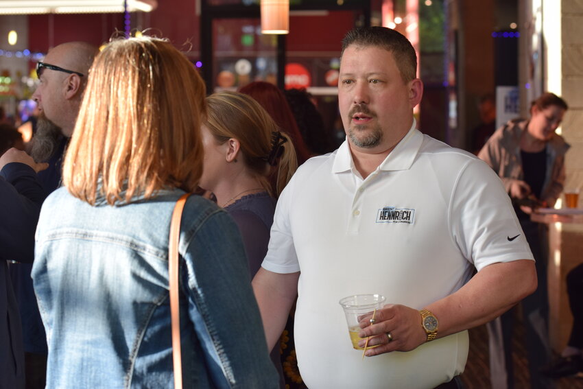 Brent Hennrich speaks to an attendee of his campaign kickoff event earlier this year.