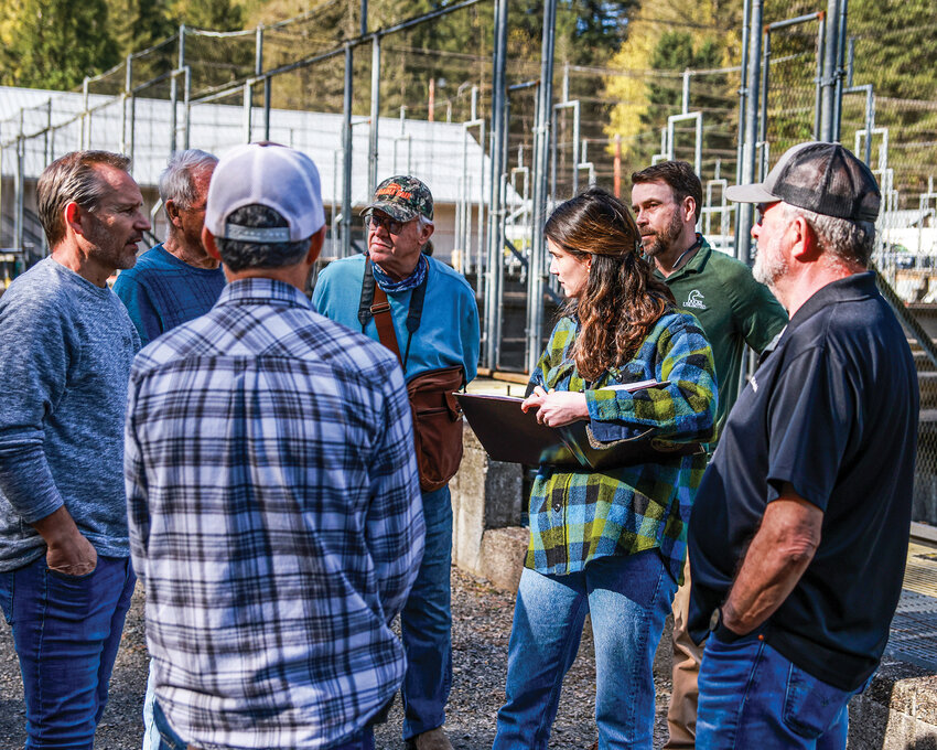 U.S. Rep. Marie Gluesenkamp Perez, D-Skamania, listens to local stakeholders during a tour of the mothballed Skamania Fish Hatchery near Washougal on Tuesday, April 7.