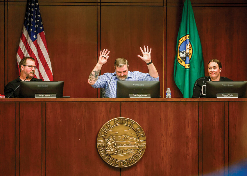 Battle Ground Mayor Eric Overholser demonstrates &ldquo;jazz hands&rdquo; to deter community members from clapping in attendance at the Monday, April 6, city council meeting from clapping after the council passed a less restrictive ordinance on RV and trailer parking.