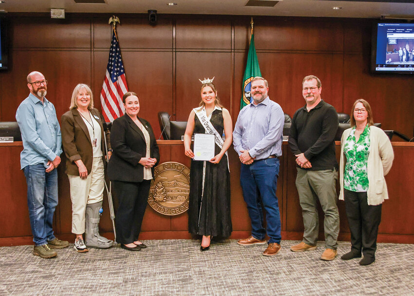 Natalie Worthy, center, founder of the nonprofit Amplify the Arts, and Miss Greater Vancouver 2026, stands with Battle Ground City Council after Mayor Eric Overholser read his mayoral proclamation officially proclaimed the week of April 12-17 as &ldquo;Student Artist Week&rdquo; during the council&rsquo;s Monday, April 6 meeting.
