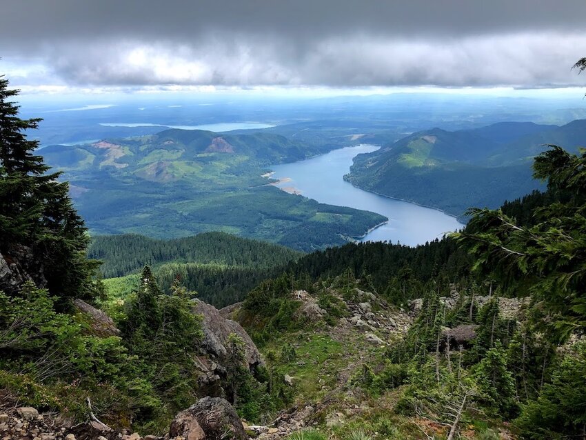 Clouds hang over Lake Cushman, as seen from the mountains of the Olympic National Forest. The U.S. Forest Service has announced plans to close 57 research stations in 31 states.