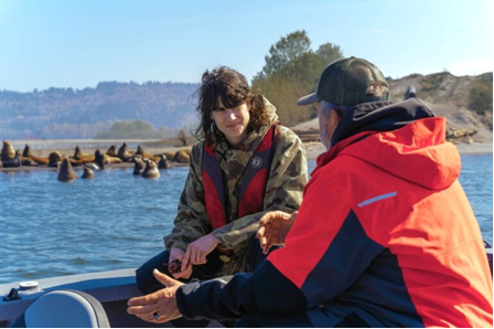 U.S. Rep. Marie Gluesenkamp Perez speaks to an angler as sea lions are seen in the background in this photo provided by the congresswoman&rsquo;s office.