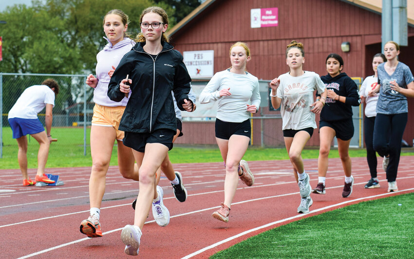Prairie High School athletes run together during practice on Tuesday, April 21. Local volunteers are organizing track events for ages seven and up at the school as a first step toward rebuilding programs lost after districtwide cuts.