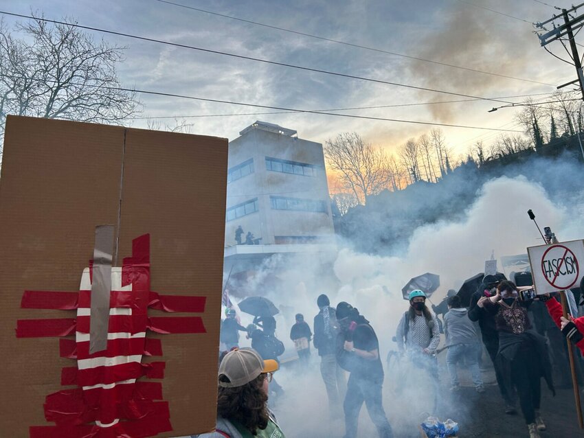 Members of 30 Oregon labor unions organized a march against Immigration and Customs Enforcement, or ICE, near an ICE facility in Portland on Jan. 31, 2026. The march ended at the facility, where federal officers shot tear gas, pepper balls and rubber bullets at the crowd, which included children. (Photo by Alex Baumhardt/Oregon Capital Chronicle)