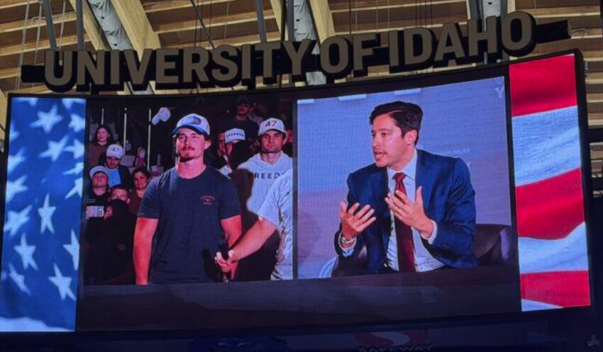 Michael Knowles (right) takes a question from the audience at a Turning Point USA event at the University of Idaho.