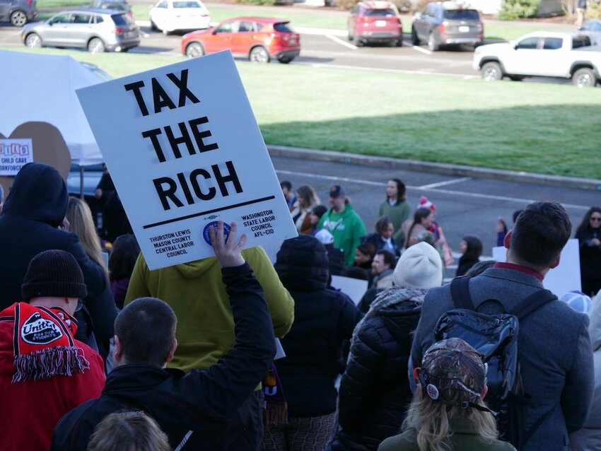 Labor unions and other supporters of an income tax on millionaire earners rallied at the Washington state Capitol in Olympia in February. A growing number of liberal states are considering raising taxes on their wealthiest residents.