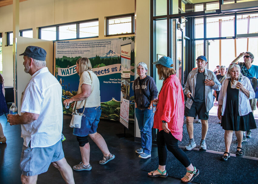 Attendees of the Ridgefield National Wildlife Refuge&rsquo;s grand opening ceremony for the Community Nature Center walk into the newly completed building at the Carty Unit on Sunday, May 3.