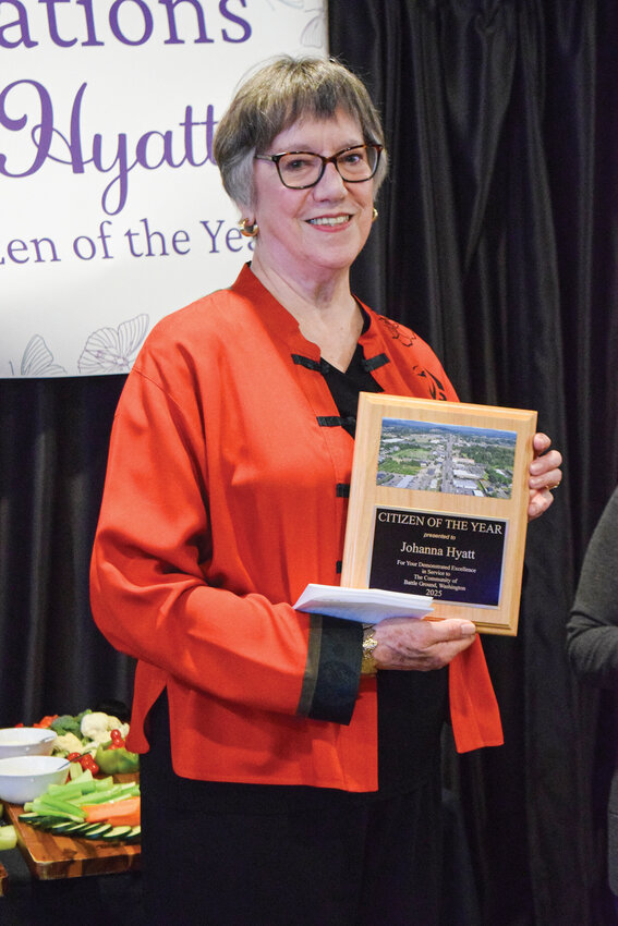 Johanna Hyatt holds a plaque during an April 29 celebration at Prairie Tavern. Hyatt was named Battle Ground&rsquo;s 2025 Citizen of the Year for her years of volunteer service.