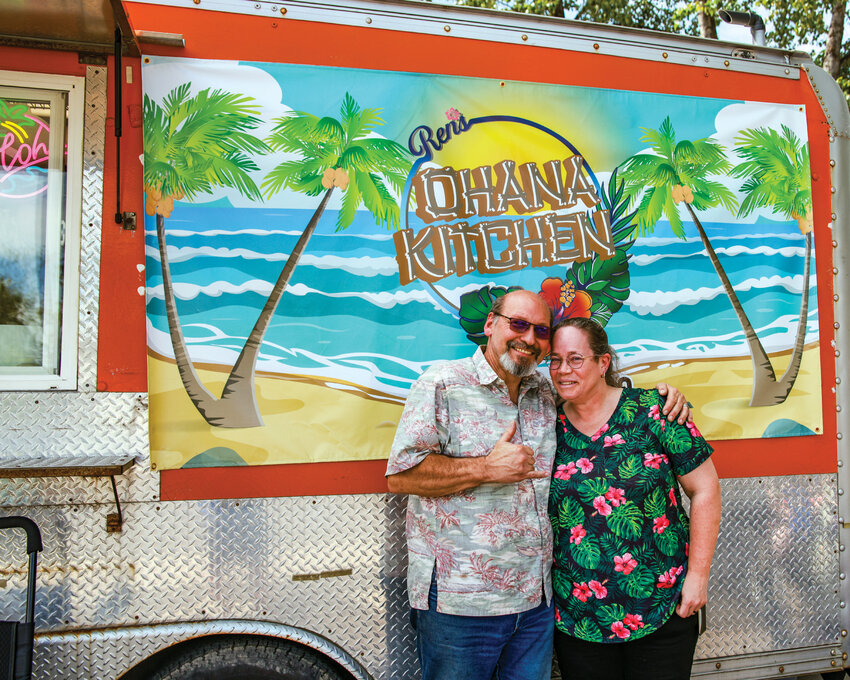Pila Neilson, left, and Cathy Neilson, stand in front of their new food cart, &ldquo;Ren&rsquo;s Ohana Kitchen,&rdquo; which opened on Friday, May 1, in the Battle Ground Station Food Cart Pod on Main Street in Old Town.