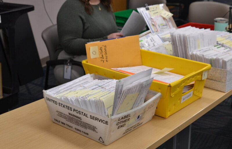 Ballots that had arrived by mail or were set aside on Election Day, 2024, sit on a table at the Cass County Courthouse in North Dakota on Nov. 18, 2024.