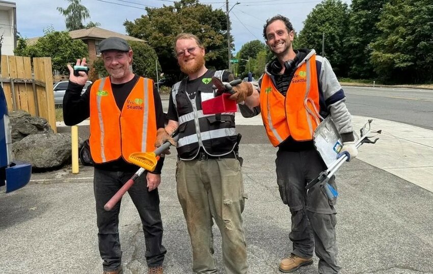 Residents of the sanctioned homeless camp United We Stand in Seattle, from left to right, Timtoo, Don and Philip, pose for a photo.