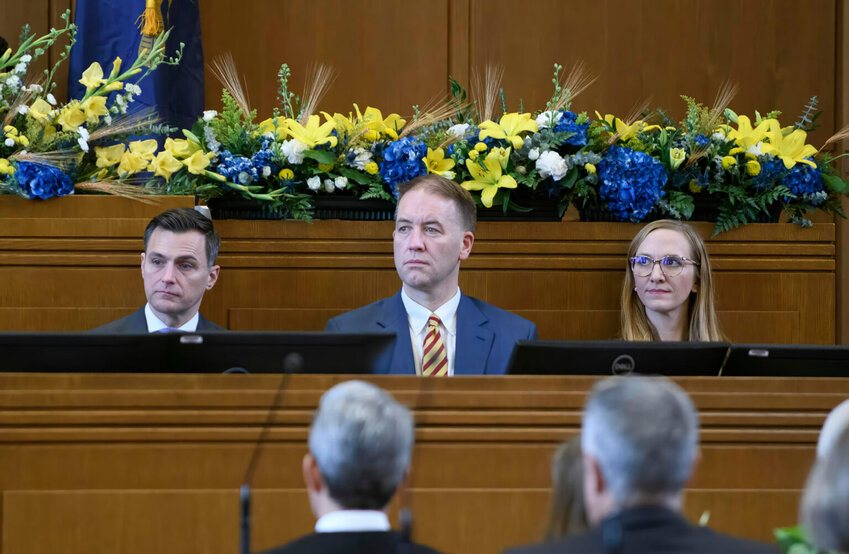 Statewide elected officials Attorney General Dan Rayfield, Secretary of State Tobias Read and Labor Commissioner Christina Stephenson sit on the House floor on Monday, Jan. 13, 2025. (Photo by Laura Tesler/Oregon Capital Chronicle/Pool)