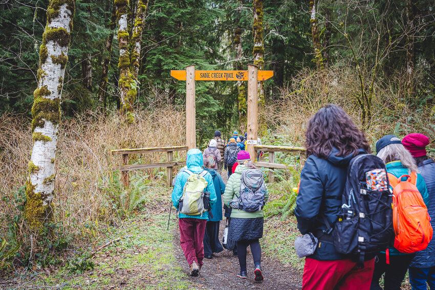 Members of the Elwha Legacy Forests Coalition walk on a trail near the state-managed Sadie Creek Campground near the Northern Olympic Coast.