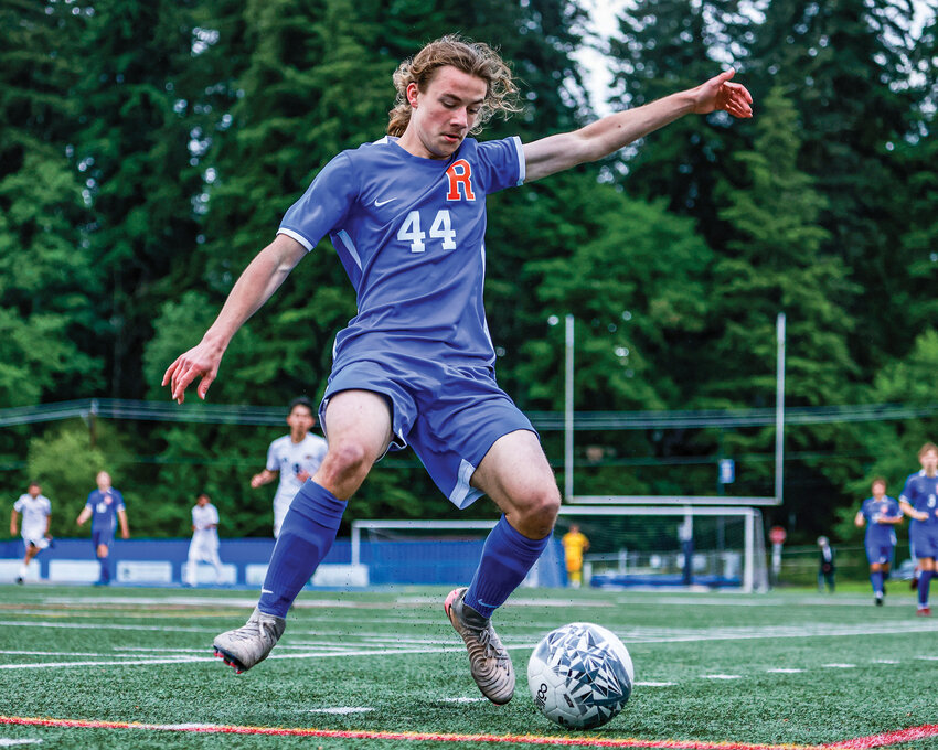 Ridgefield&rsquo;s Tyson Hair tries to keep the ball in play in the Spudders&rsquo; offensive zone during Ridgefield&rsquo;s 4-1 win over the Centralia Tigers on Thursday, May 14.
