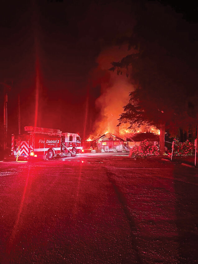 Fire crews respond to a structure fire at the historic Central Picnic Shelter in Lewisville Regional Park during the early morning hours of Tuesday, May 12.