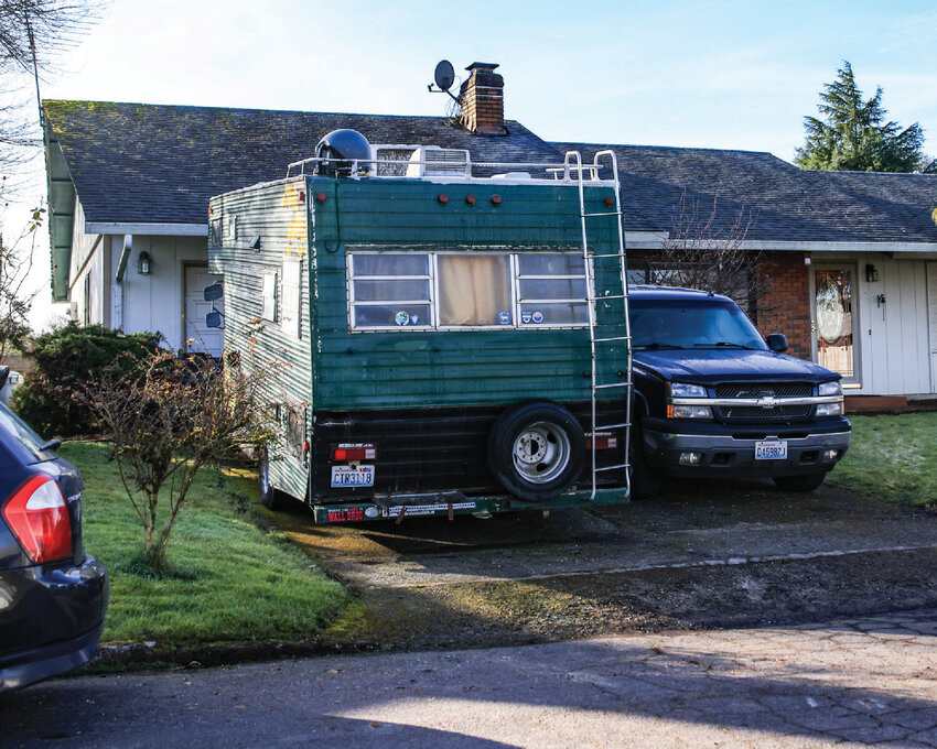 A recreational vehicle sits parked in front of the building line in Battle Ground on Friday, Feb. 6. The Battle Ground City Council voted in April to relax restrictions on RV, trailer and boat parking, but on May 18, council members discussed revisiting the ordinance after Fire Marshal Chris Drone raised concerns about fire safety and setback requirements.