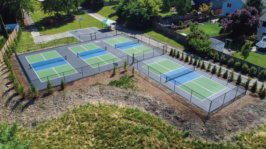 Four newly striped pickleball courts sit beside the basketball court at Heritage Park on Thursday, May 21, ahead of the facility&rsquo;s opening. La Center officially opened the courts Friday, May 22, after completing fencing, landscaping and final striping work.