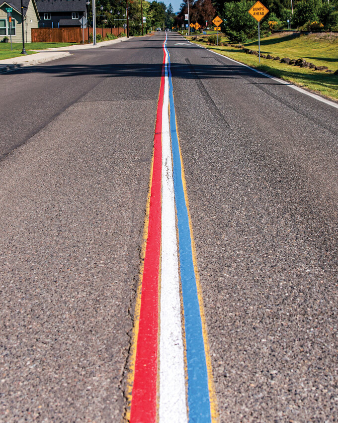 Railroad Avenue in Yacolt is adorned with red, white and blue road striping on Friday, May 22. But a complaint to the town may cause the centerline striping to be painted over with standard yellow.
