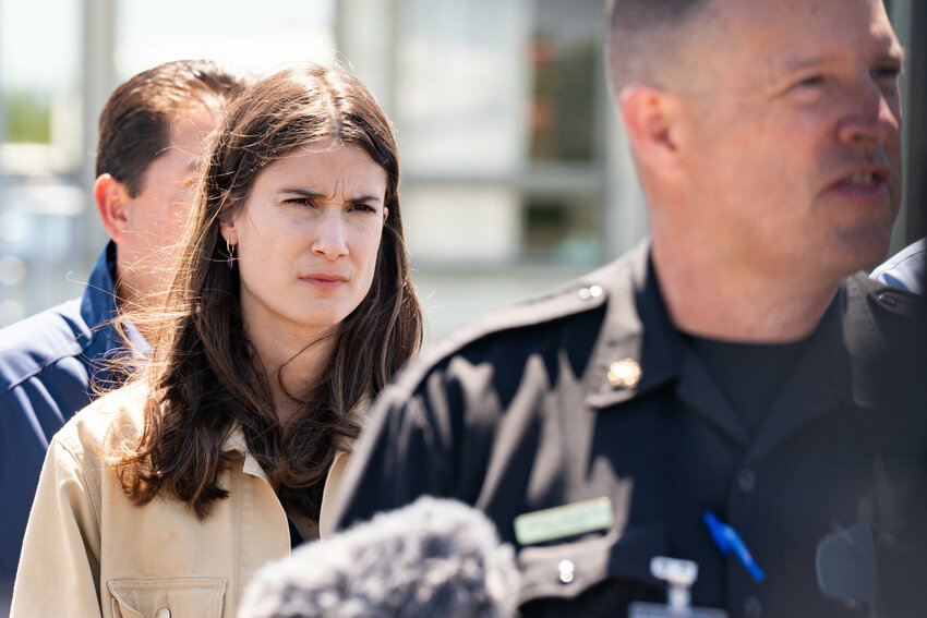 Rep. Marie Gluesenkamp Perez, D-Skamania, listens as Cowlitz 2 Fire &amp; Rescue Fire Chief Scott Goldsteins peaks to the press at Nippon Dynawave Packaging Company in Longview Wednesday, May 27.