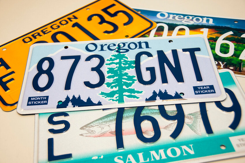 Oregon license plates are pictured. Transportation officials in the state are reviewing a decision to refuse undercover license plates to federal agencies that has provoked a legal challenge from the Trump administration. (Photo courtesy of the Oregon Department of Transportation/Flickr)