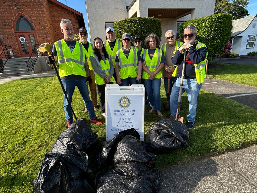 Battle Ground Rotary Club members picked up trash, swept sidewalks and pulled weeds during a cleanup event in Old Town Battle Ground on Wednesday, May 20.