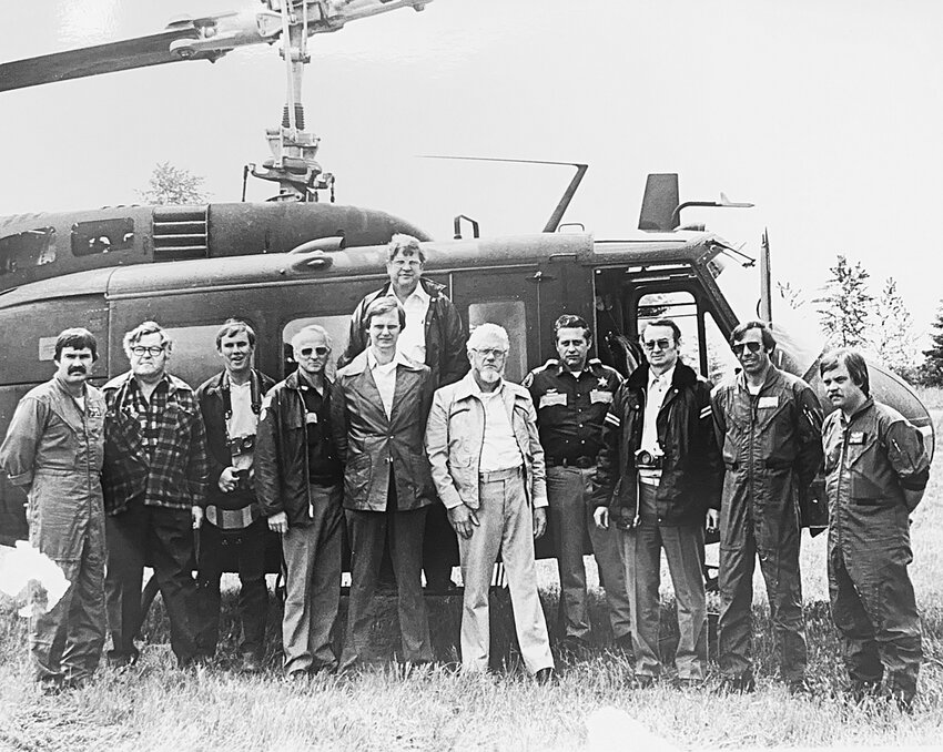 Gary Odegaard, fifth from the left in front, stands outside a Bell UH-1 Iroquois &mdash; commonly known as a &ldquo;Huey&rdquo; &mdash; on May 24, 1980. The others aboard the helicopter from Fort Lewis with Odegaard included state Secretary of the Senate Sid Snyder, and state Sens. Albert L. &ldquo;Slim&rdquo; Rasmussen, Peter Von Reichbauer, Don Talley and Del Bausch. Also present was former Lewis County Sheriff Bill Logan.